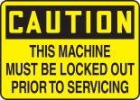 THIS MACHINE MUST BE LOCKED OUT PRIOR TO SERVICING
